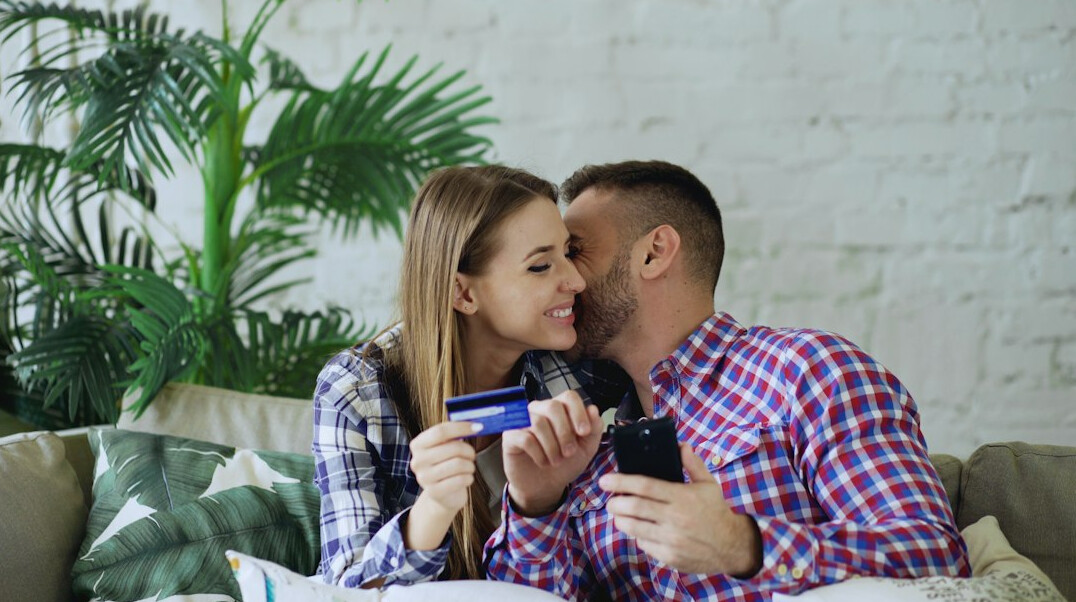 happy couple saving money